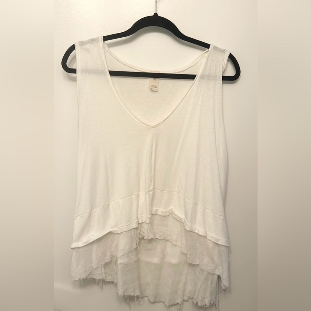 We the Free. White sleeveless top. Tattered edge flowy bottom.